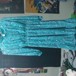 A cute long green and purple dress/ flowers